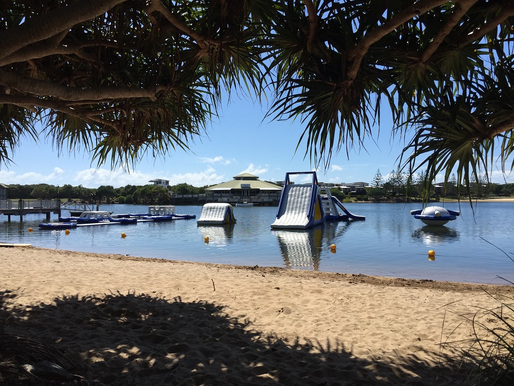moving to the sunshine coast - backyard view of ocean with floating obstacle course at twin waters