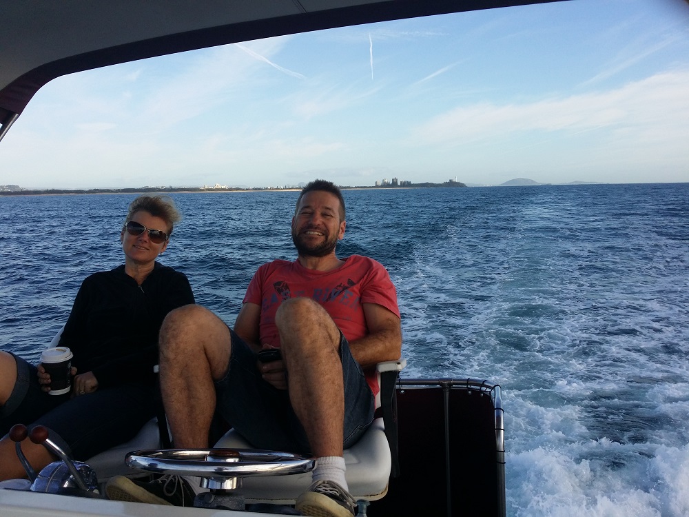 Byron & Kath sitting on a boat heading from Mooloolaba to Moreton Island