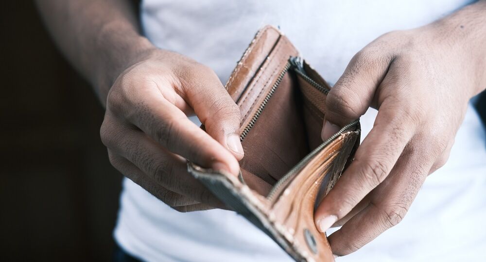 person holding empty billfold