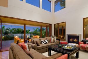 A stylish living room on the Sunshine Coast, equipped with a couch, coffee table, and two chairs for a welcoming atmosphere