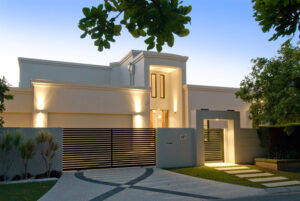 Modern home on the Sunshine Coast features a sleek white exterior and a stylish black gate