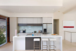 An image of stylish kitchen design with a generous island and chic bar stools.