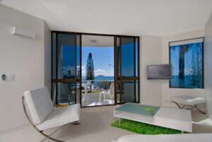 Home appraisal : A modern apartment living space with large windows facing the ocean on the Sunshine Coast.