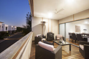 An image of a well-furnished balcony on the Sunshine Coast, furnished with a table and chairs.